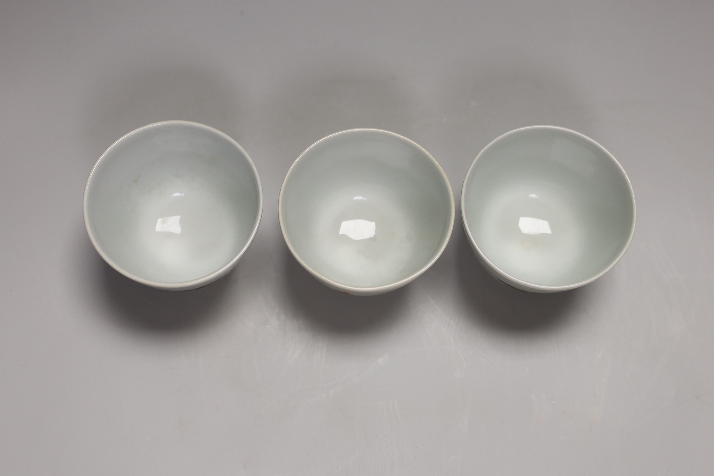 Three Chinese famille rose 'immortals' cups, 6cm tall